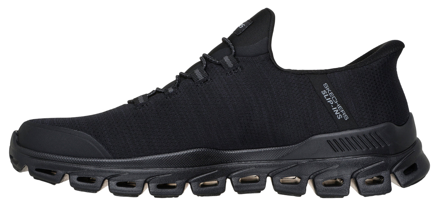 A black shoe with a sporty design and the text 'SKECHERS SLIP-INS' visible on the side.