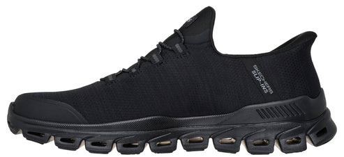 A black shoe with a sporty design and the text 'SKECHERS SLIP-INS' visible on the side.