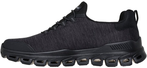 A black men's athletic sneaker with a textured knit upper, laces, and a thick, segmented, black sole with cutouts.