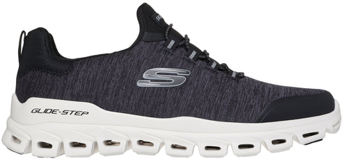 A charcoal gray fabric running shoe with a white, heavily segmented, thick foam sole labeled "GLIDE-STEP" on the heel and a silver "S" logo on the side.