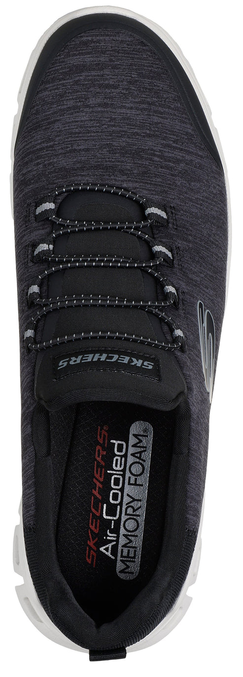 A top-down view of a grey and black slip-on athletic shoe with decorative laces, featuring the visible text 'SKECHERS' and 'SKECHERS Air-Cooled MEMORY FOAM' printed on the insole.