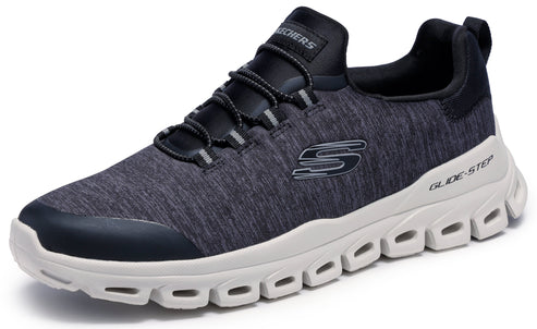 A gray athletic shoe with a black synthetic toe cap, tongue, and laces, featuring a thick, white, geometric Glide-Step foam midsole with side cutouts and a dark gray S logo on the side.