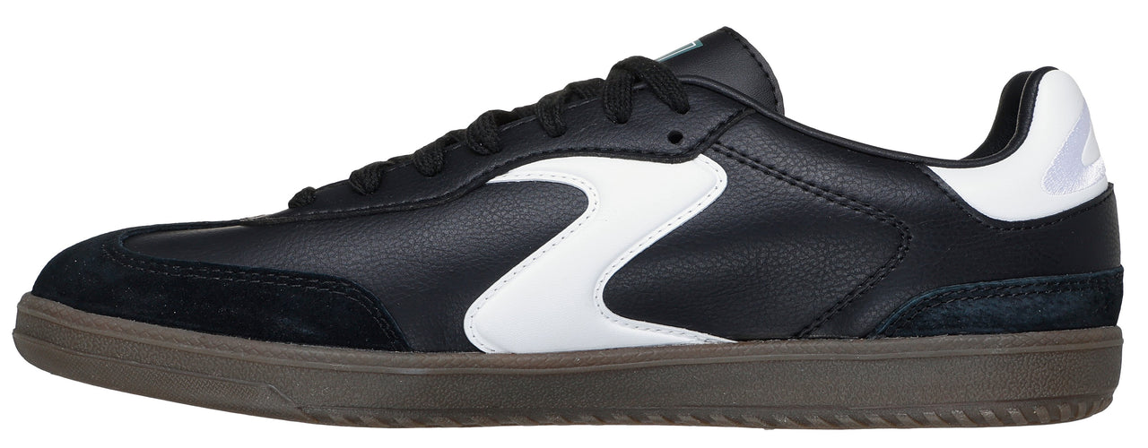 A black and white sneaker with black shoelaces and a brown sole.