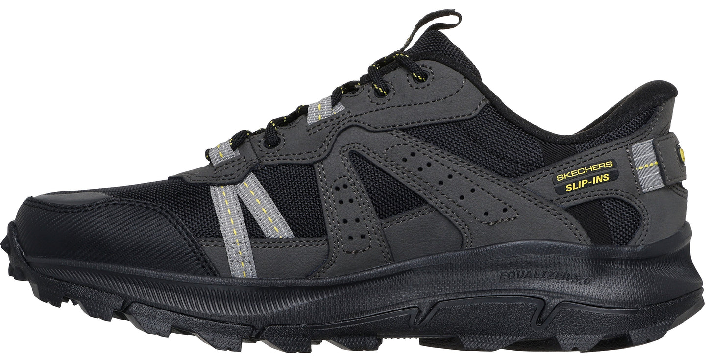 A black and gray hiking shoe with a slip-ins label.
