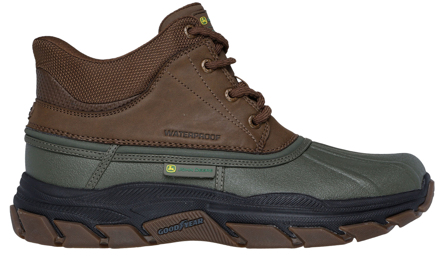 Brown and green waterproof duck boot with laces and thick black sole.