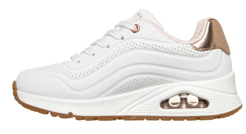 White sneaker with gold accents and air cushioning.