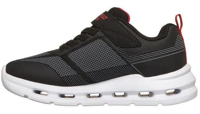 Side view of a black sneaker with a white midsole that has hollow oval-shaped openings. The shoe has black laces and a black strap over the top of the foot. The tongue is red with the word "LIGHTS" in black letters.