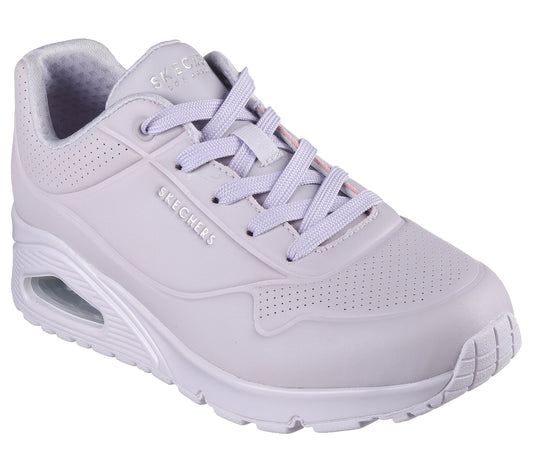 Light purple sneaker with white sole, with visible air cushion and the word "SKECHERS" embossed on the side.