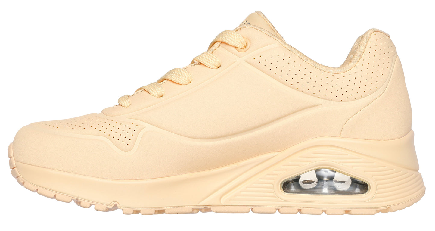 Beige athletic shoe with air pocket in sole.