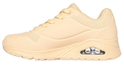 Beige athletic shoe with air pocket in sole.