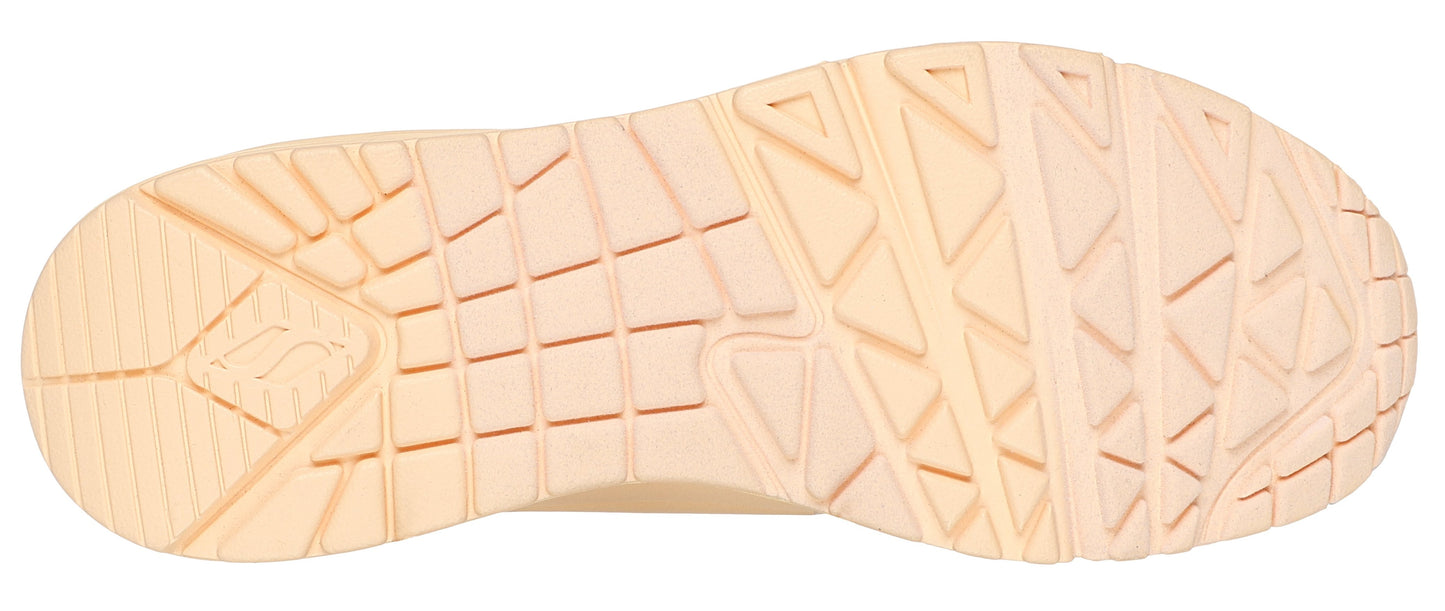 Beige shoe sole with geometric treads.