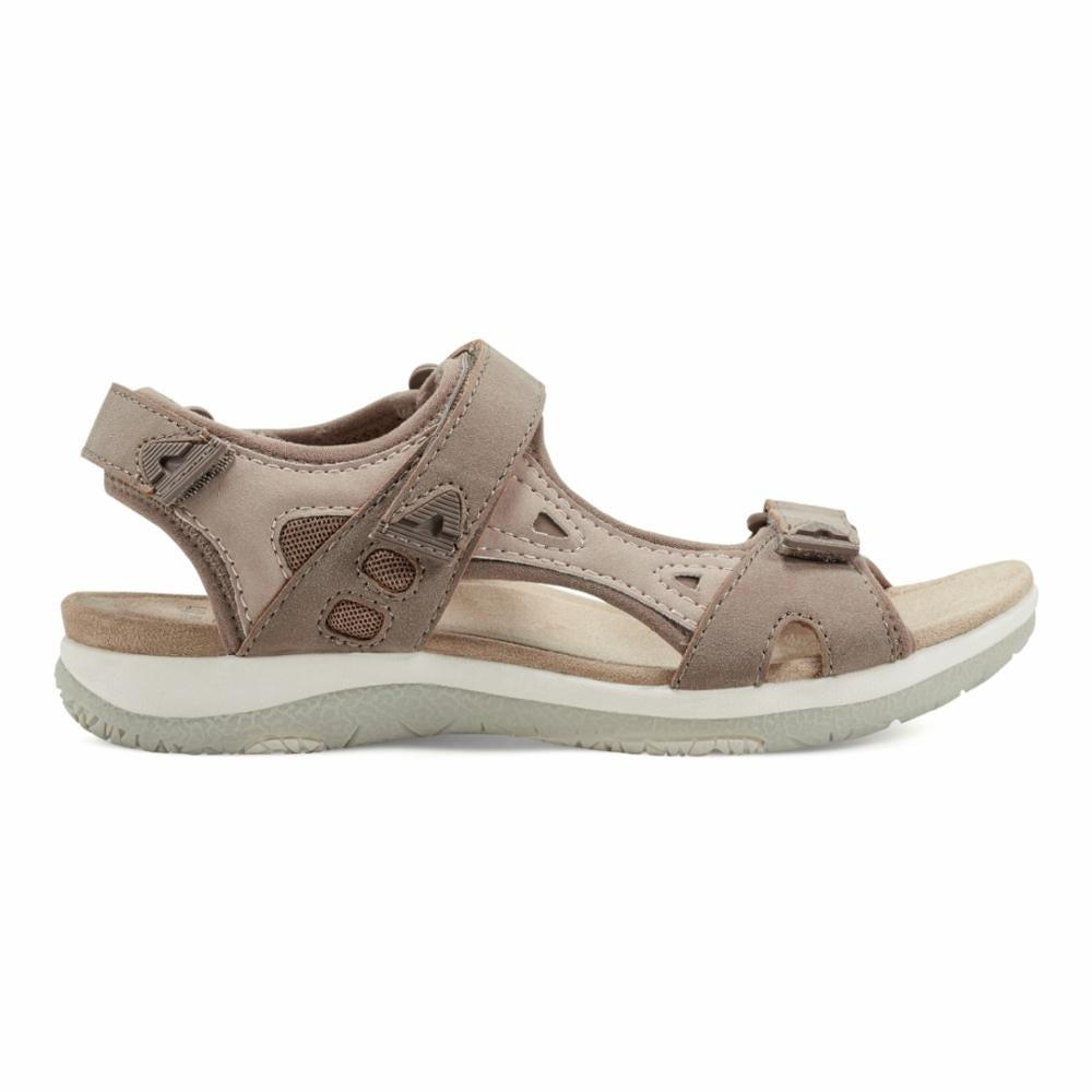 Taupe sandal with hook and loop straps and a low, athletic-style sole.