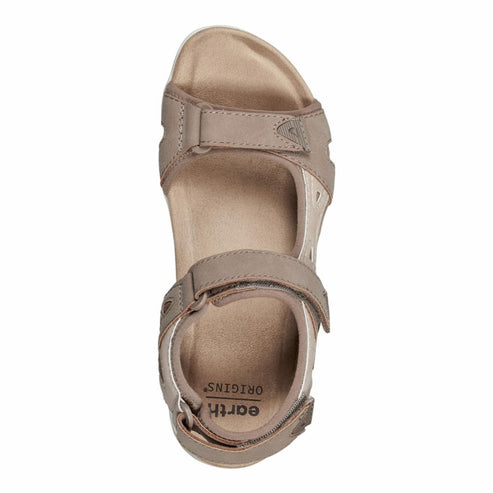 Top-down view of a taupe-colored sandal with multiple velcro straps, revealing the insole marked with 'EARTH ORIGINS'.