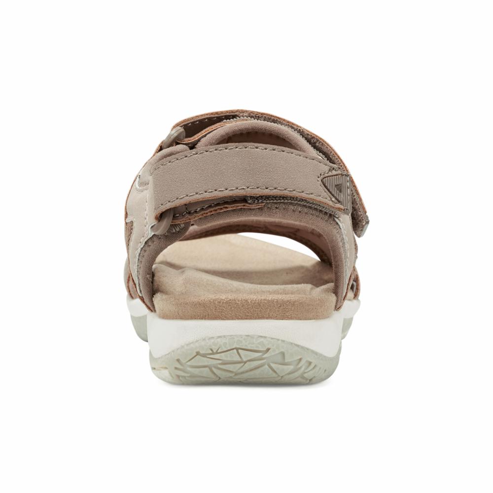Tan sandal with velcro straps.
