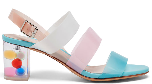 Block heeled sandal with clear straps in pastel colors and clear heel filled with small colored balls.