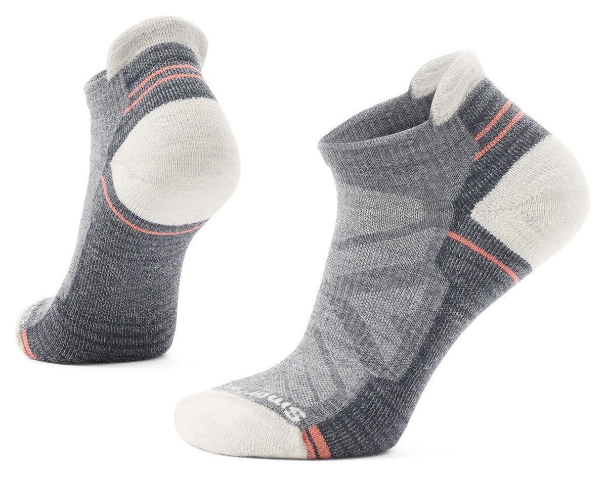 A pair of low-cut gray athletic socks with coral trim.