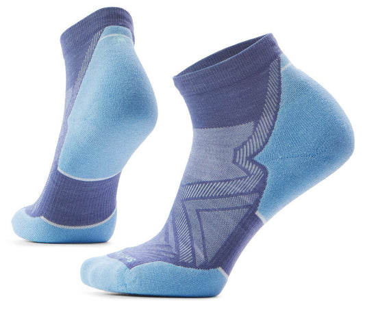 Two light blue and purple ankle socks, one on its side and one vertical, show their knit construction, including patterned support.