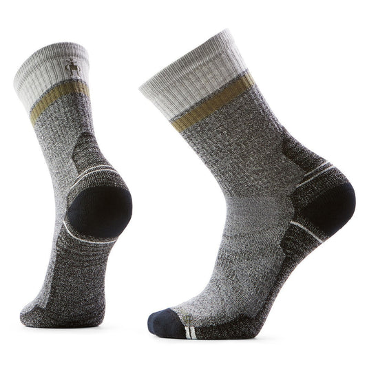 A pair of gray hiking socks with a cushioned heel and toe. Each sock has a grey cuff with a gold ring below it.