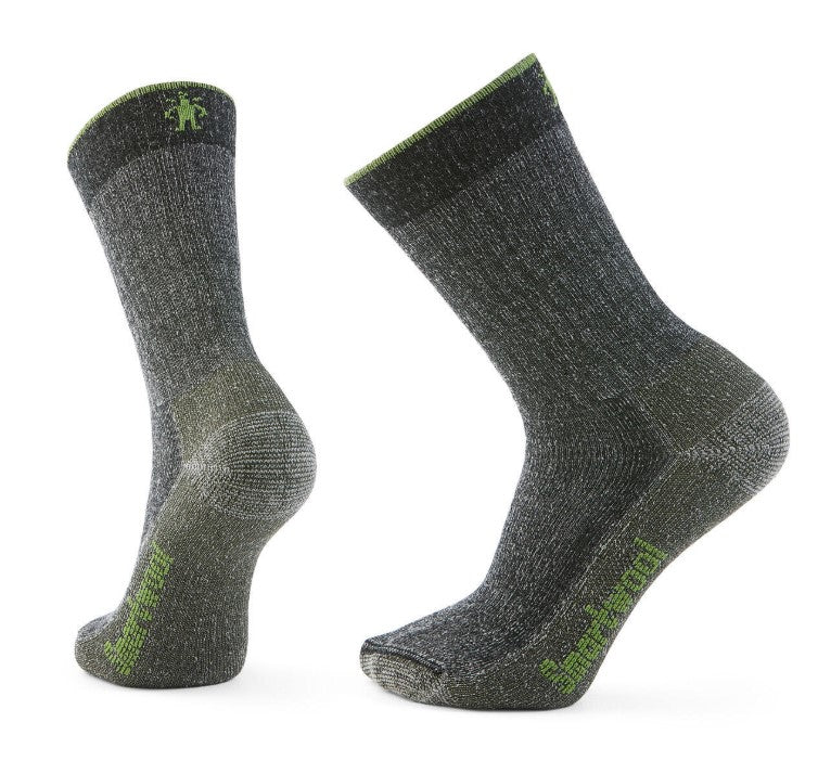 Two gray socks, one on the left and the other slightly right, with a green accent on the top and sole.