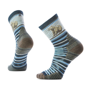 Two socks with horizontal stripes and a bear design on the upper part.