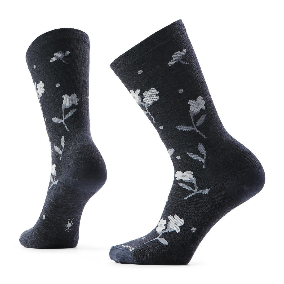 Pair of black crew socks with gray floral pattern.