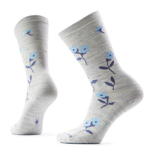 Two light gray socks with blue flower patterns.