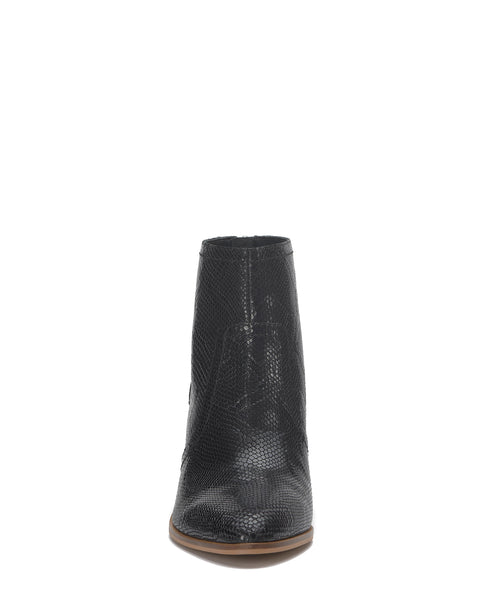 Close-up of a black snakeskin-textured ankle boot with a chunky heel.