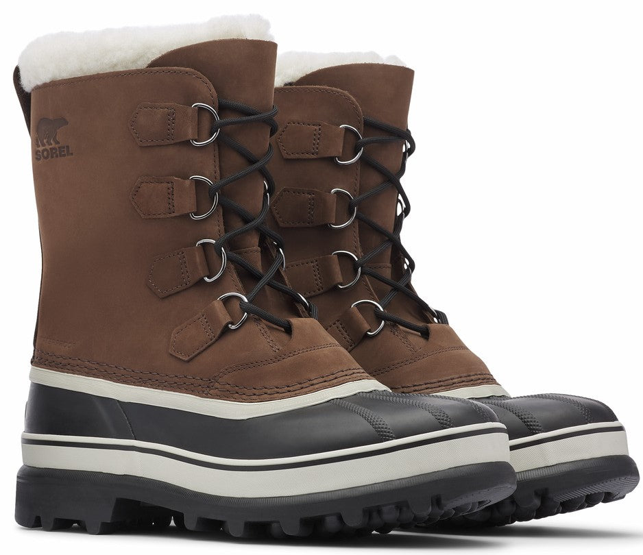 Pair of brown waterproof insulated winter boots with black soles and white trim, laced up and lined with faux shearling.