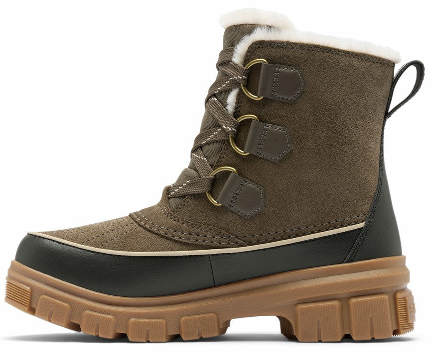 A brown suede winter boot with a thick, textured tan rubber sole, a black waterproof rubber rand, lace-up front with metal hardware, and a white faux-fur lining along the collar.