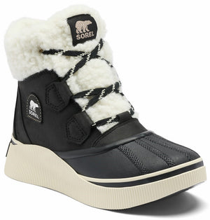 A black SOREL winter boot with a thick cream-colored textured rubber sole, a white faux-fur cuff, and black crisscross laces.