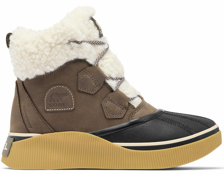 A brown and black SOREL waterproof winter boot with white shearling lining, a thick ribbed tan sole, and a black rubber toe cap.