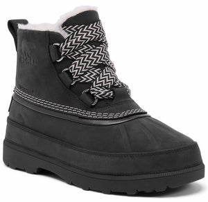 A black waterproof lace-up winter boot with a faux fur-lined ankle, chevron-patterned laces, and a thick, ridged rubber sole. The boot features a side pull tab, metal eyelets, and the embossed Sorel logo on the outer ankle.