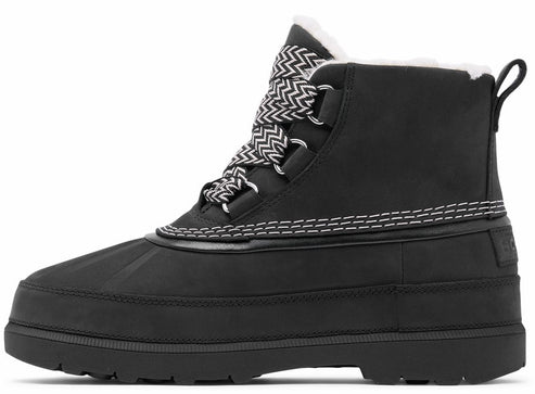 A black lace-up winter duck boot with a white faux-fur collar, a thick rubber sole, and a patterned black-and-white zigzag lace, viewed from the side.