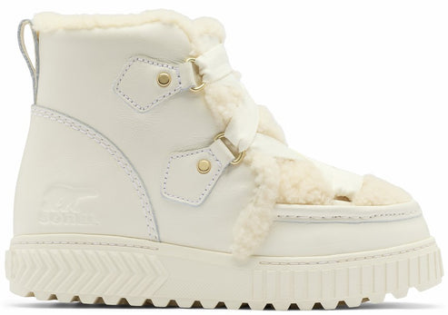 A cream-colored, ankle-high winter boot with white faux-fur trim along the tongue and collar, featuring ribbon laces, gold-toned hardware, a thick, lugged platform sole, and a debossed logo on the side heel.