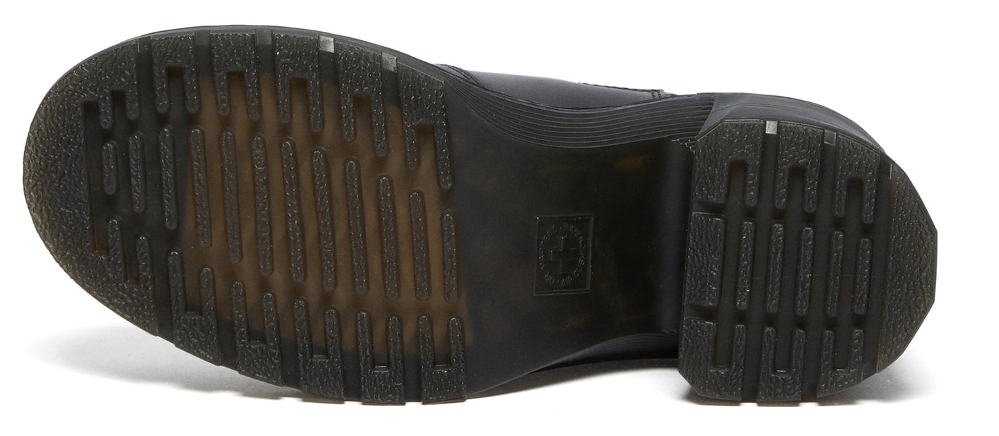 Bottom view of a shoe with a treaded rubber sole.