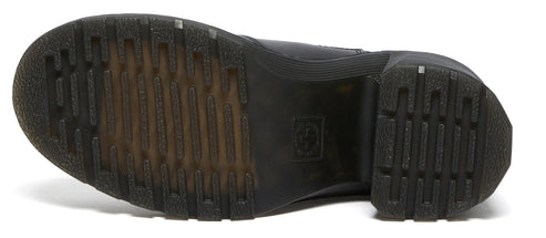 Bottom view of a shoe with a treaded rubber sole.