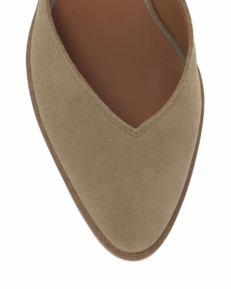 Close-up of the toe of a tan suede shoe with a pointed toe.
