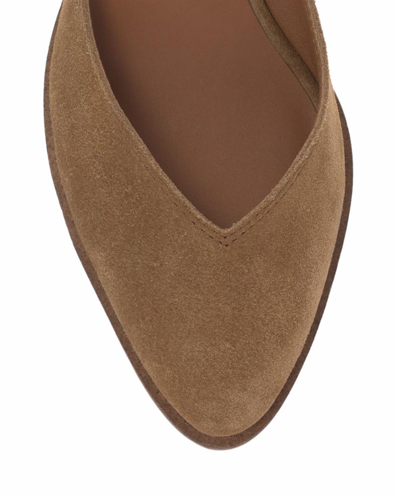 Close-up of a brown suede pointed-toe flat.
