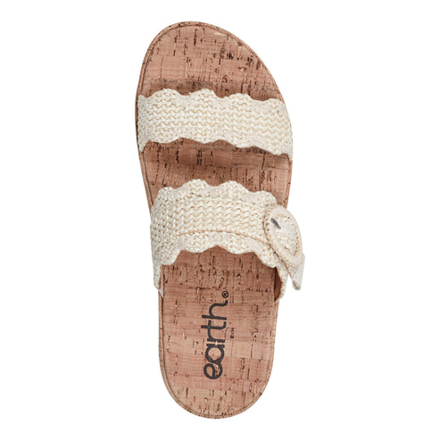 Top-down view of a sandal with two textured off-white straps over a cork footbed with the text "earth."