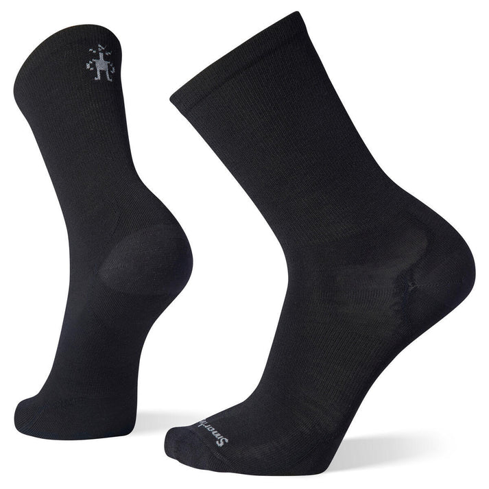 Two black socks, one upright and one bent, with a small logo at the top and text near the toes.