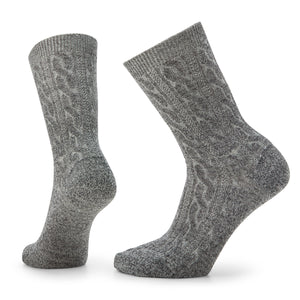 Two gray wool socks with cable knit pattern.