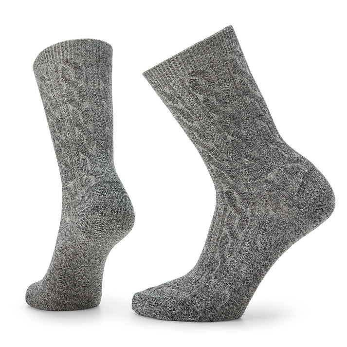Two gray wool socks with cable knit pattern.