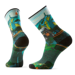Two hiking socks with a green, blue, and yellow topographic map print and black heel and toe.