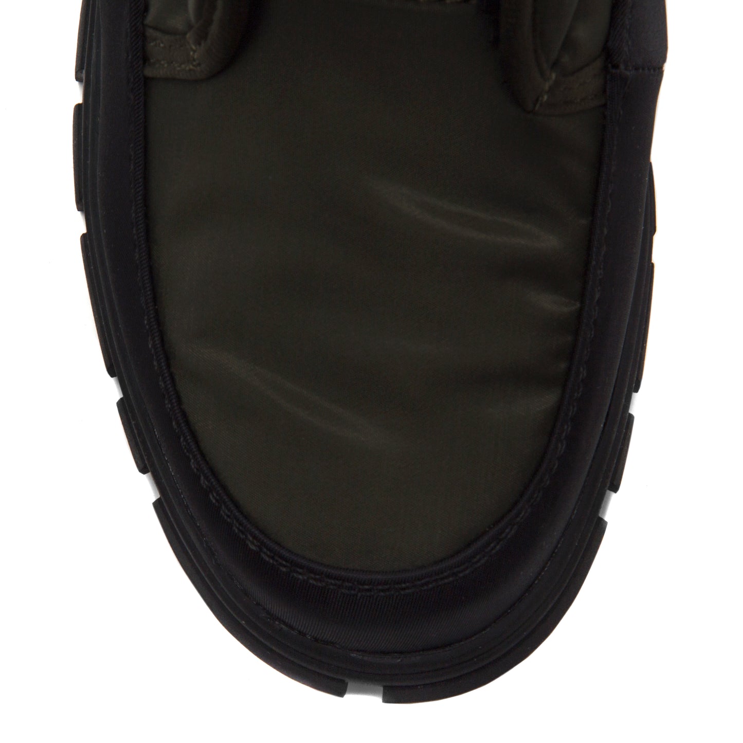 Olive green puffy shoe with black sole.