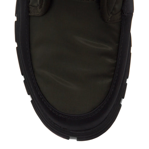 Olive green puffy shoe with black sole.