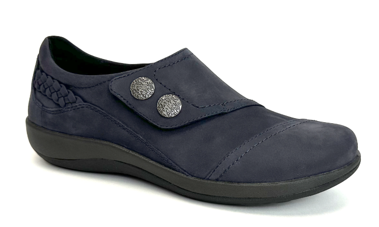 Slip-on navy shoe with button detail.