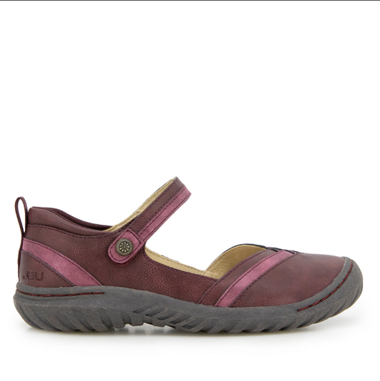 A maroon leather Mary Jane-style flat shoe with a textured gray rubber sole, a hook-and-loop adjustable strap, and small metal hardware detail on the side.