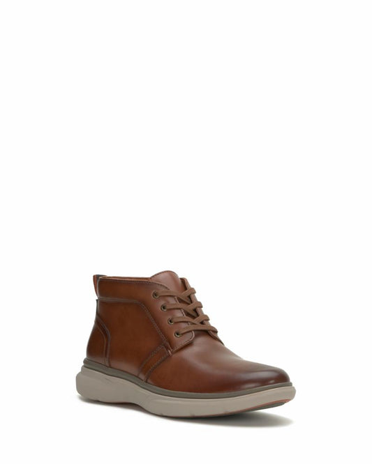 Tan leather ankle boot with lace-up closure and a gray sole.