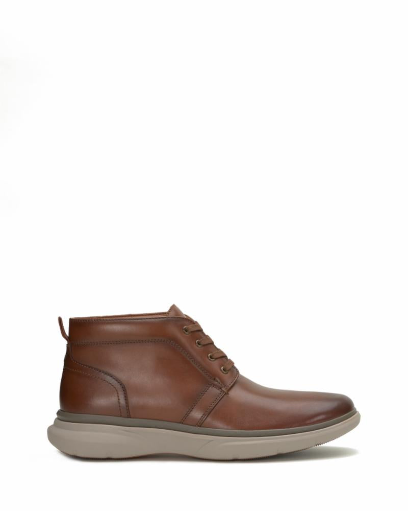 Brown leather ankle boot with light gray sole and lace-up closure.