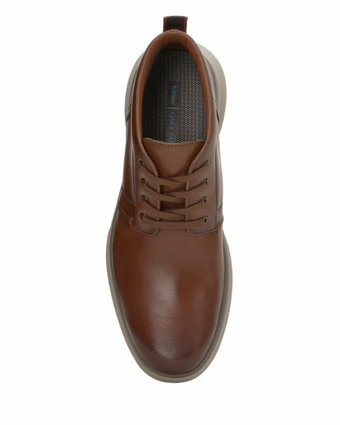 Top-down view of a tan leather lace-up dress shoe with a visible inner lining.